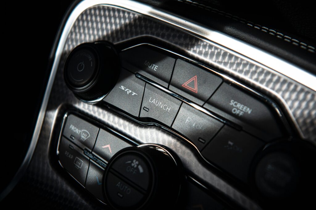 Detailed view of a modern car dashboard with various control buttons.